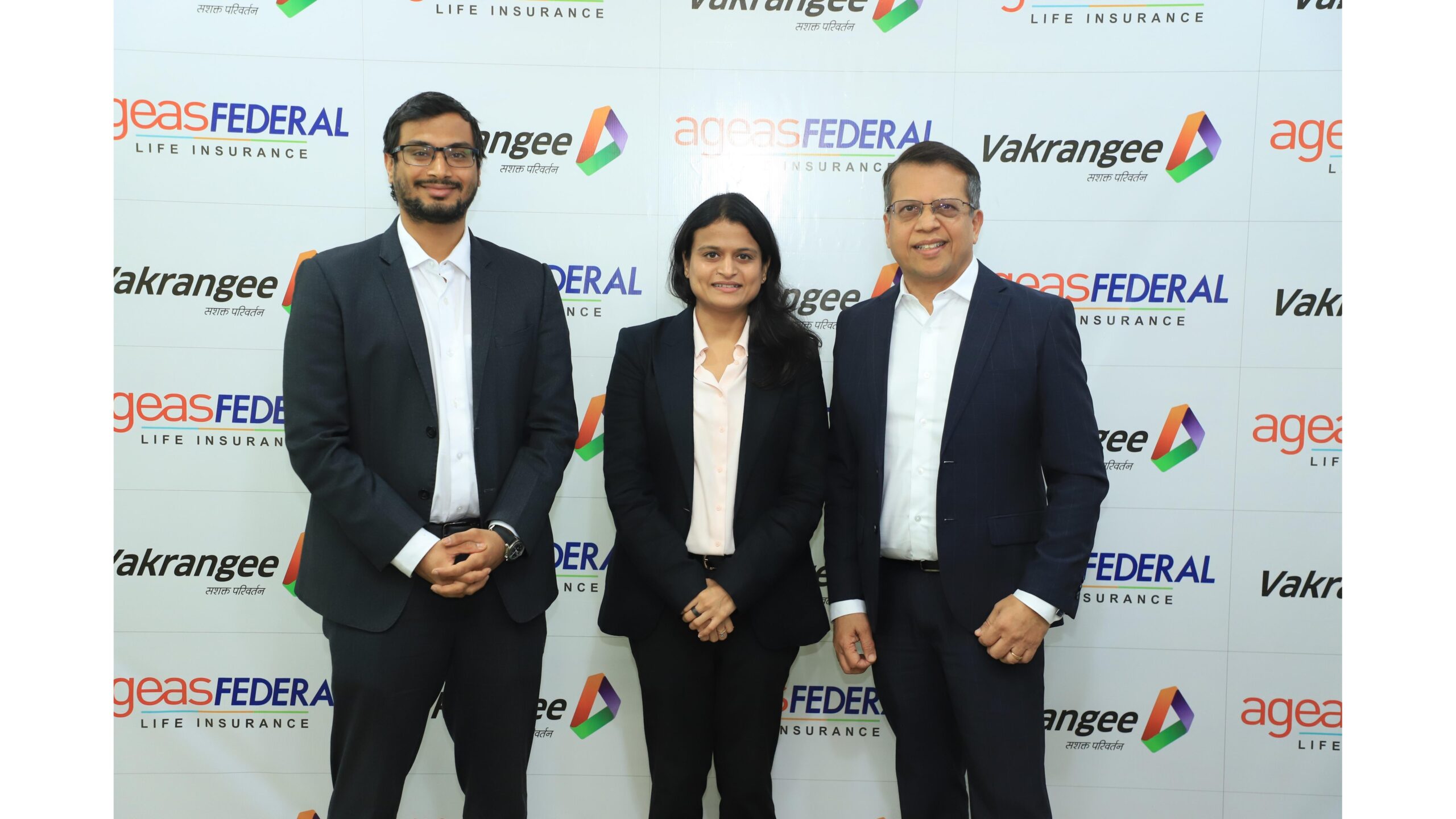 Vedant NandwanaManaging Director Vakrangee Ltd Divya Nandwana Executive Chairperson Vakrangee Ltd and Jude Gomes MD CEO Ageas Federal Life Insurance at the partnership signing 1 scaled