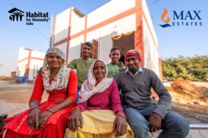 Beneficiaries of the initiative by Max Estates and HFH —Sumitra (centre) with her family outside their newly built home in Aakera village